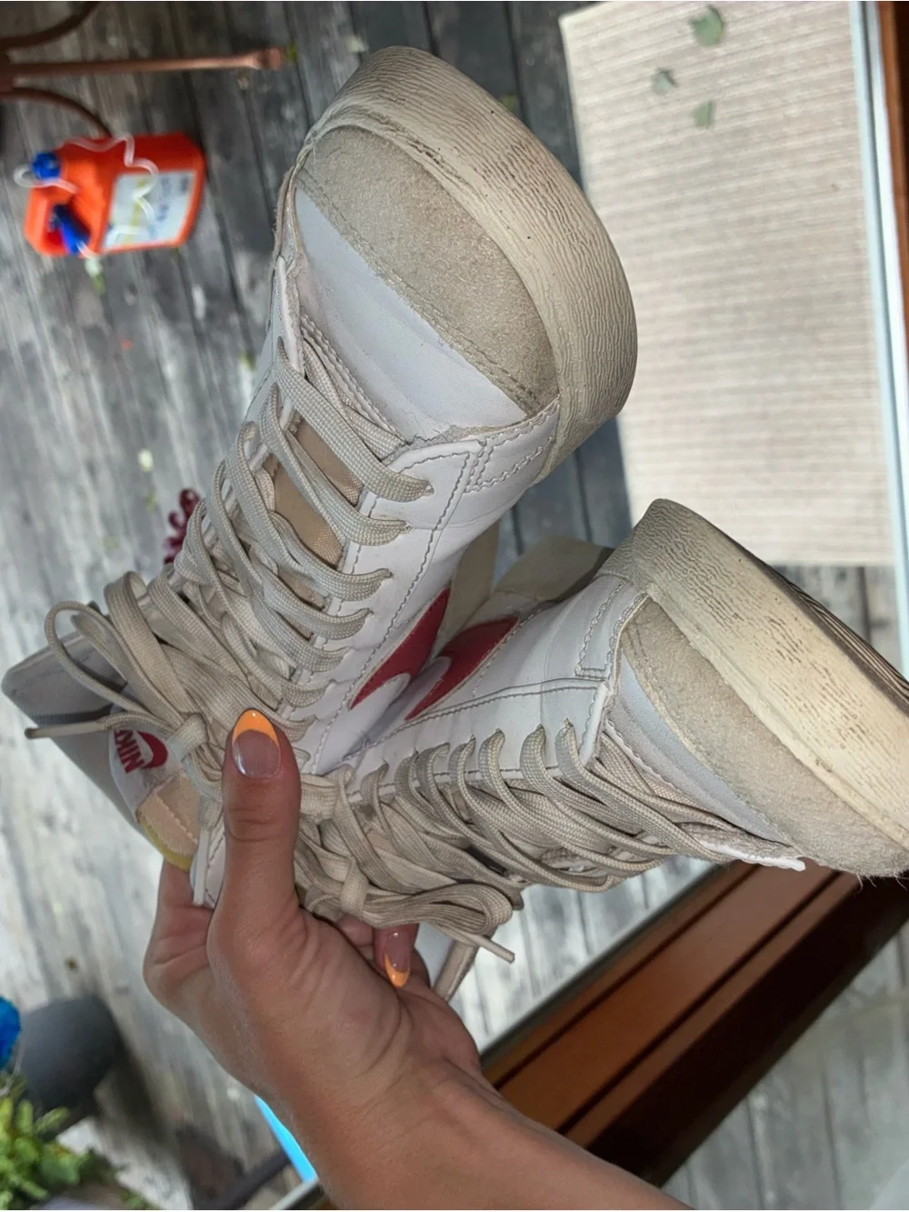 Nike Women's White High-Top Sneakers with Red Swoosh